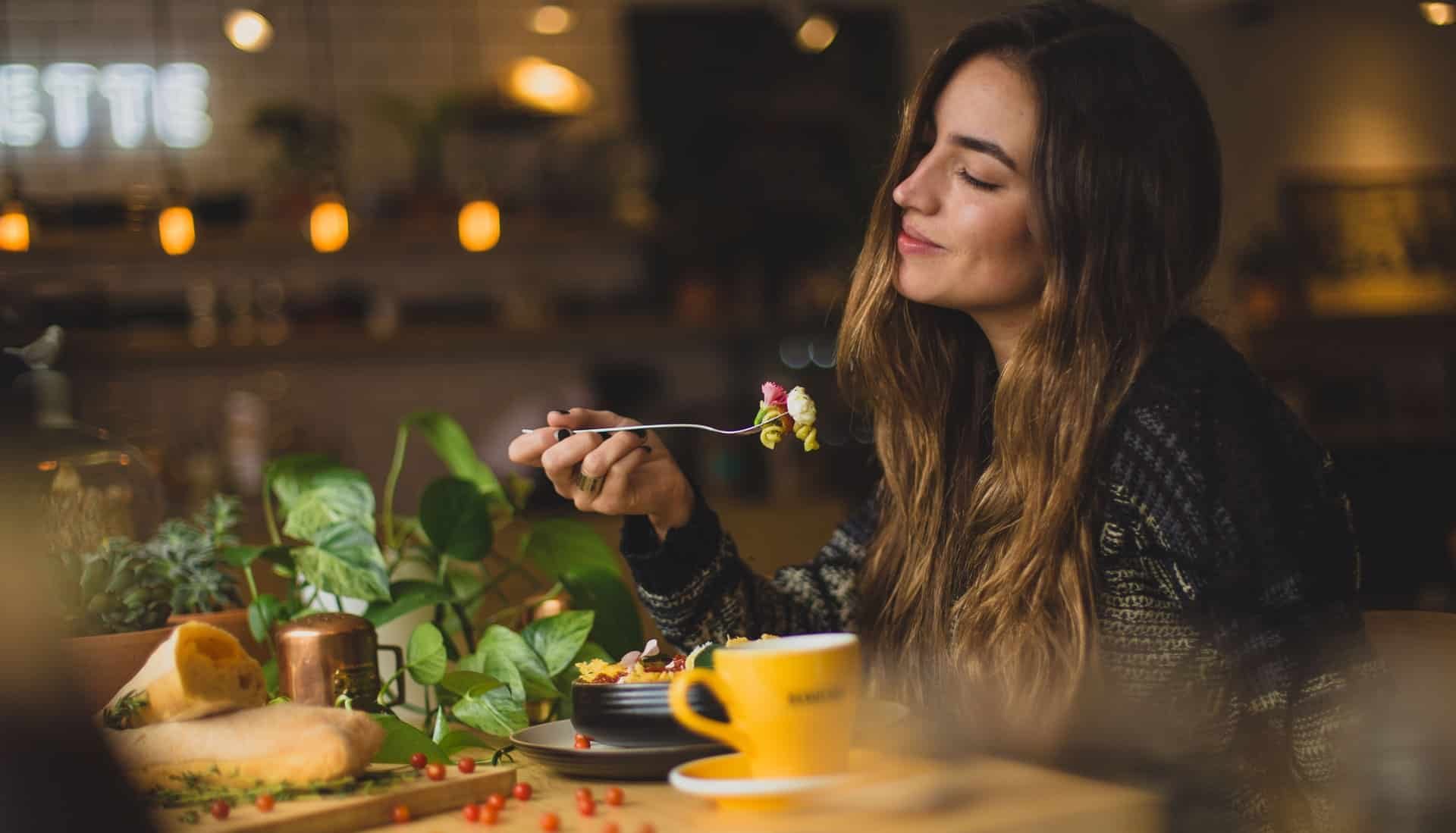 A girl enjoying a meal in Downtown Vancouver Restaurant